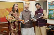 Paes, Hingis present signed racquets to Modi