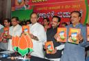BJP promises free laptops, rice at Rs one