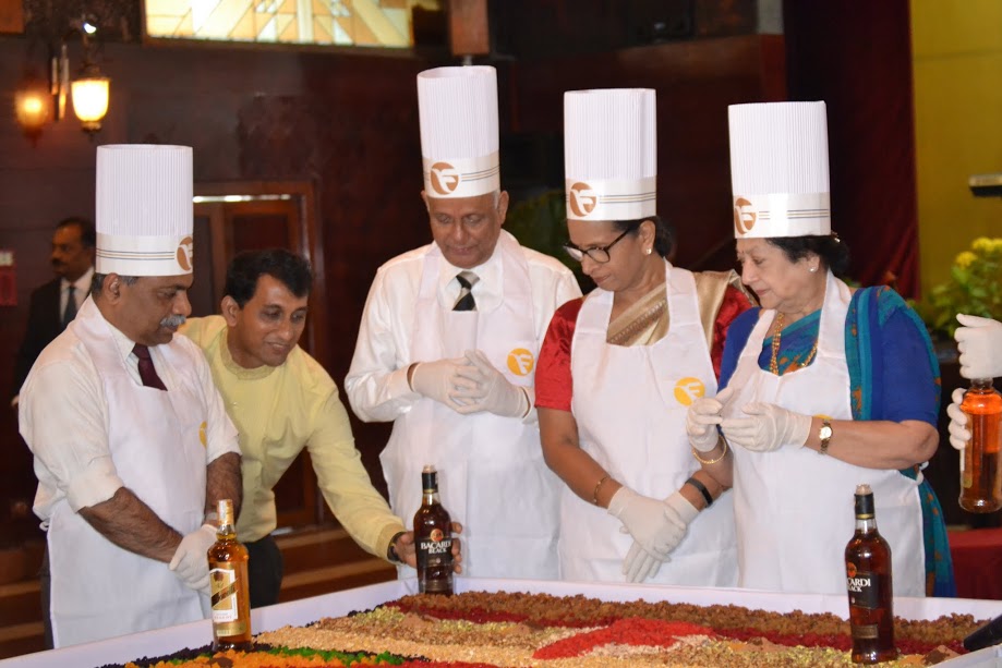 Futune Inn Valley View celebrated tradition of preparting Christmas Cake by mixing nuts