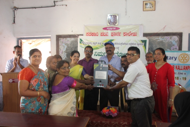 Nirmal Thonse with Rotary Kallianpur distributes 5 Incinerators to Schools around Kemmannu.