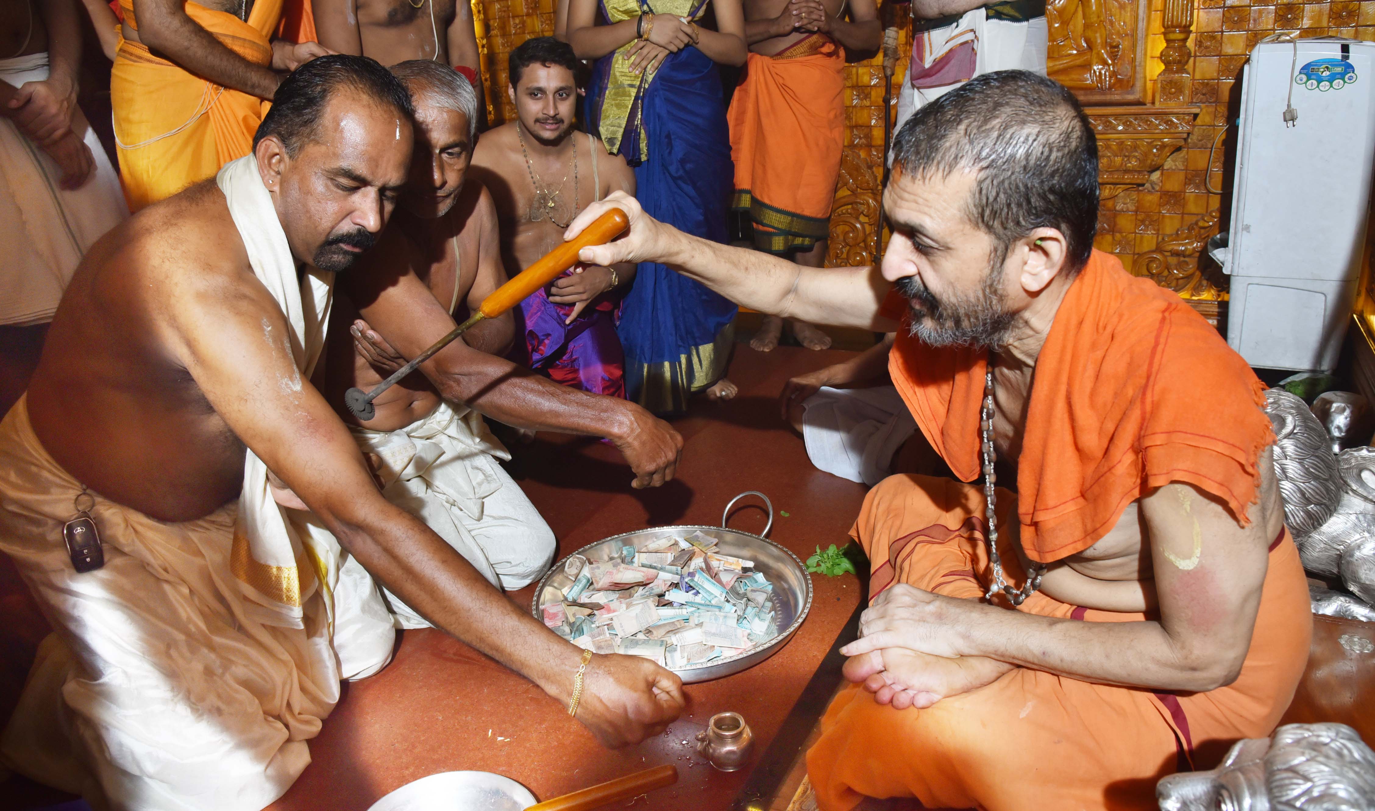 Devotees hold ’Tapta Mudra Dharana’ ritual at Sri Krishna Temple, Udupi