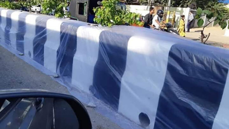 Plastic sheets protecting Guwahati road dividers from paan